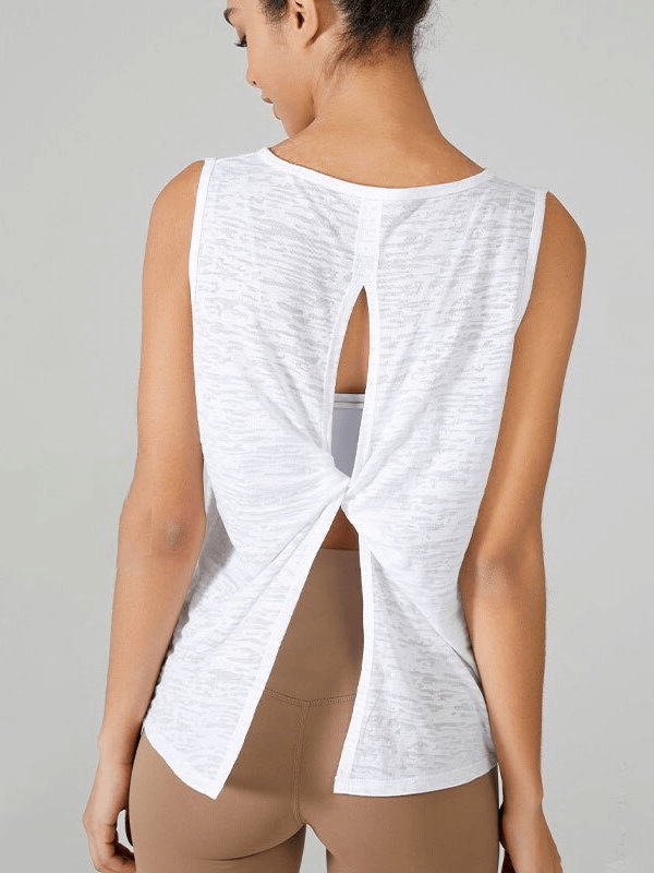 Woman wearing white sporty lightweight tank top with back cut, designed for exercise comfort and flexibility in Pilates and running.